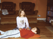 Amba gives Reiki to brother Leo. Amba and Leo