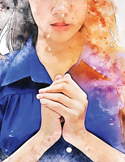 Watercolor-style art of a person with hands clasped in prayer, featuring vibrant color splashes.