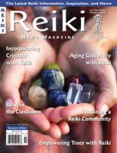 Reiki News Magazine, Summer 2024 cover featuring hands holding crystals, highlighting healing and mindfulness.