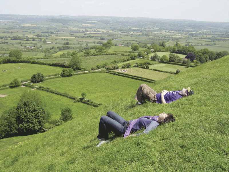 Laying in the grass on the side of the Tor Laying in the grass on the side of the Tor