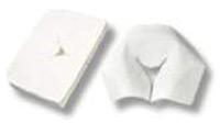 White disposable headrest covers with a central face opening, shown flat and unfolded for use on Reiki, massage, or therapy tables.