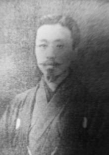 Black-and-white portrait of Matiji Kawakami in traditional clothing, with a calm expression and neatly groomed facial hair.